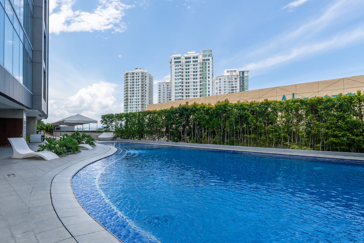 Rooftop pool with Davao City skyline view at Aeon Towers, a FlexStay-managed property