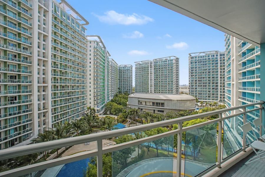 Sand-floor beach club pool amenity at Azure Residences