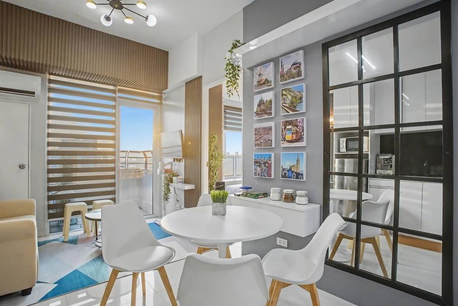 Bright dining nook with travel-photo wall art in Quezon City